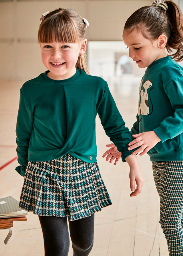 Conjunto falda pantalón y sudadera niña