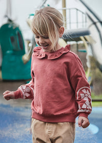 Pullover cuello volante