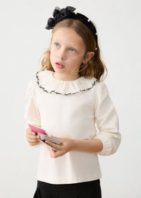 Blusa cuello volante niña