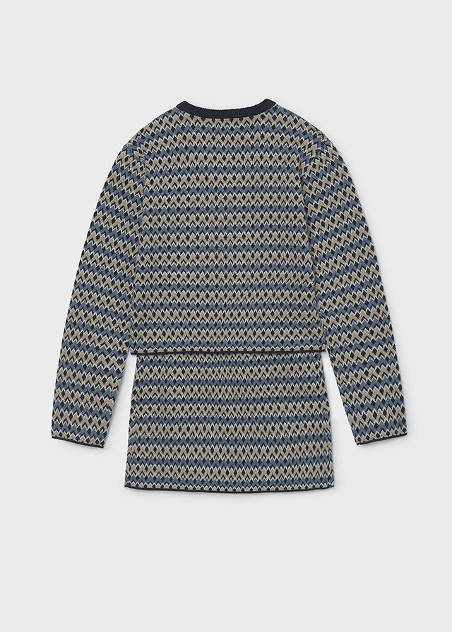 Conjunto de suéter de punto y falda para niña.